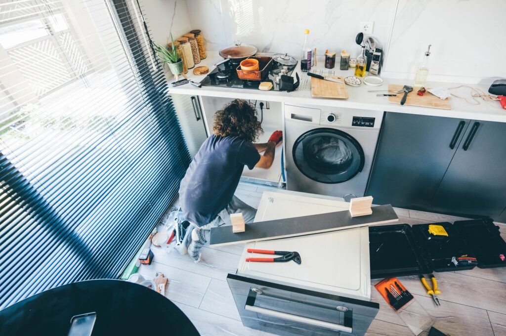 men repairing appliances in colordao springs