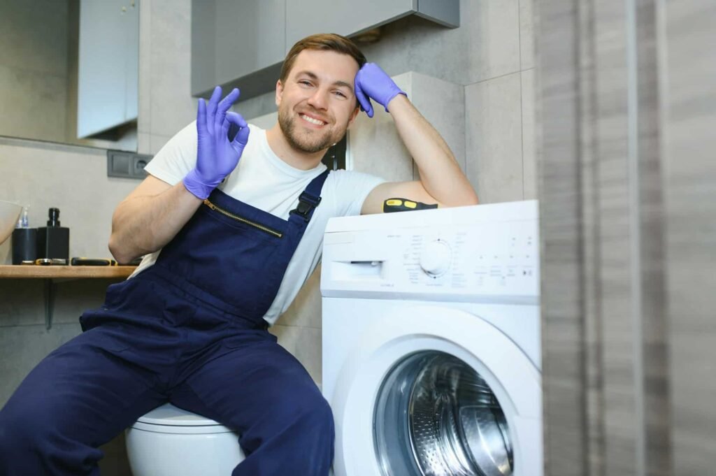 Technician repairing a washing machine